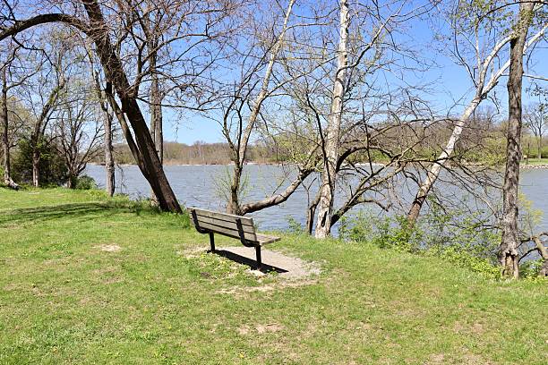istock Park Bench on the Riverbank 2217132646