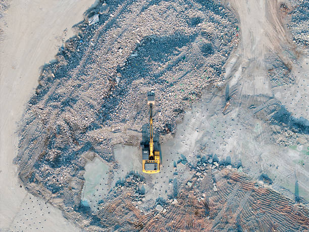 istock Excavator is demolishing a building at the construction site 2217132856