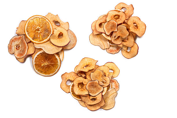 Dried fruit isolated on white background. Dried grapefruit, dried apple, dried pear slices.