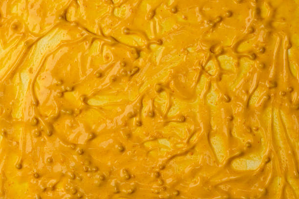 istock Yellow sauce splashes as a background. 2217133790