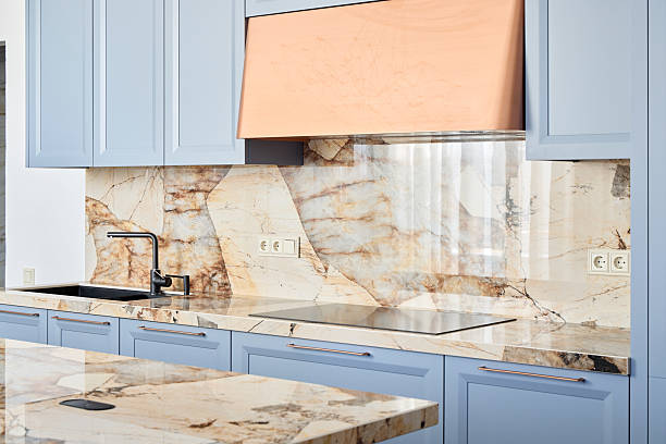 istock Elegant Kitchen Design Showcasing Stunning Marble Features and Beautiful Blue Cabinets 2217137502