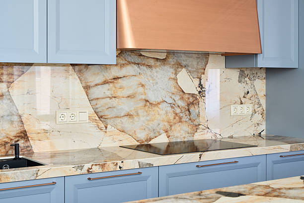 istock Stylish and Modern Kitchen Featuring a Marble Backsplash and Beautiful Blue Cabinets 2217137751