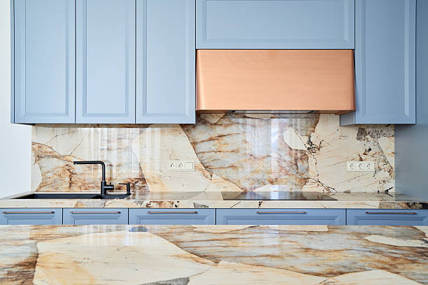 istock An Elegant and Modern Kitchen Featuring Beautiful Marble and Stylish Blue Cabinets 2217137831
