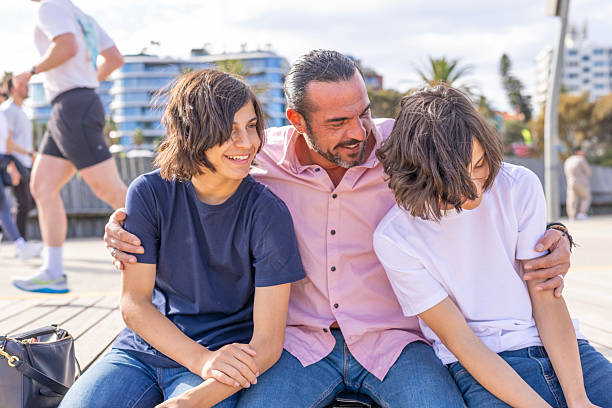 Family portrait of beautiful, smiling family. Outdoors. Close-up.