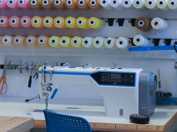 istock Close-up of a modern electronic sewing machine with colorful thread spools 2217141349
