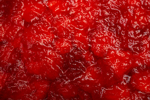 istock Gelatin layer over strawberry slices structure, abstract culinary red texture 2217143377