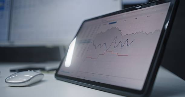 istock Digital Tablet and Computer with Multi-Monitor Desktop System Displaying Online Trading Software 2217143396