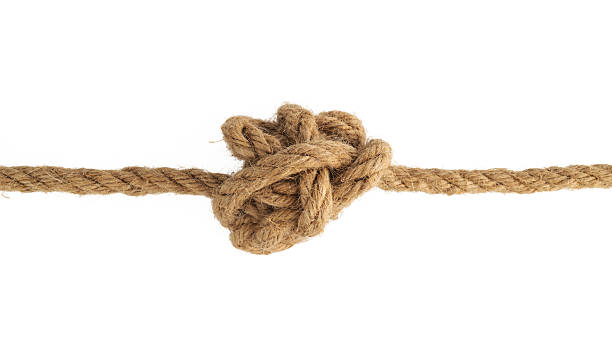istock A brown rope tied into a tension knot and pulled tight, showing stress and difficulty 2217145360