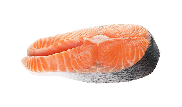 istock Steak of fresh raw salmon isolated on white 2217145378
