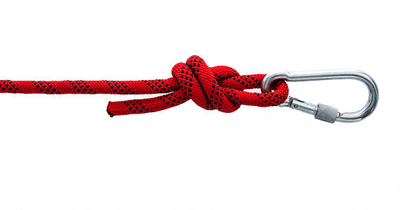 istock Red carabiner with robe isolated on white background 2217145393
