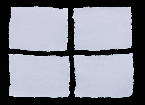 istock Pieces of torn paper on black background 2217145494