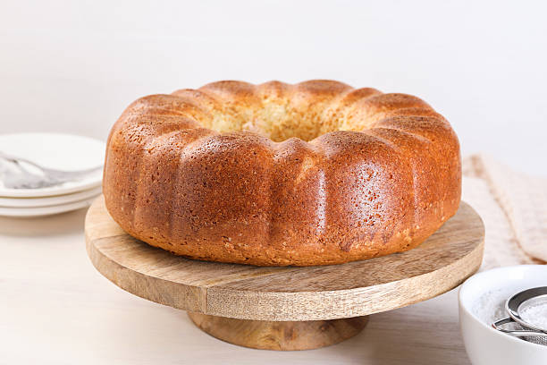 istock Freshly baked sponge cake on white wooden table, closeup 2217148176