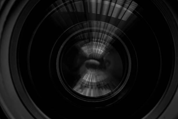 istock Close-up camera lens,Photo Camera or Video lens close-up on black background, objective, concept of photographer camera man job, looking for a photographer, 2217149838