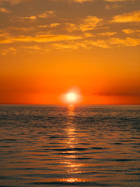 istock Orange Reflections On The Ocean Water At Sunrise 2217149970