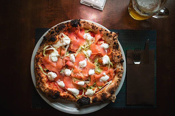 Gourmet Pizza With Salmon And Mozzarella At The Restaurant .