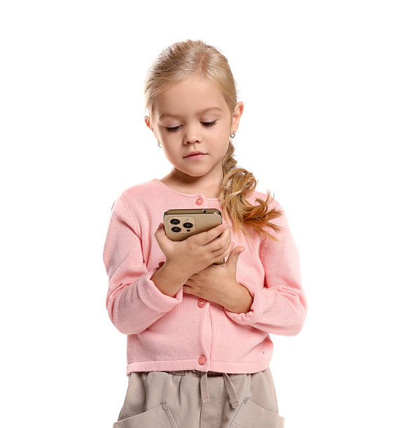 istock Cute little girl with smartphone on white background 2217151616