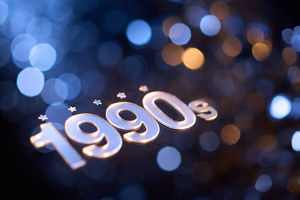Retro Still Life Composition Featuring Metallic 1990s Text with Glowing Bokeh Lights in Blue and Gold Tones
