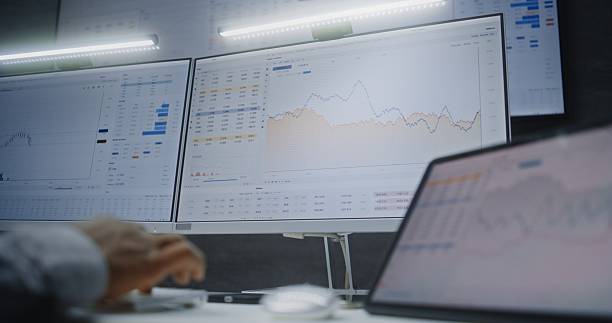istock Digital Tablet and Computer with Multi-Monitor Desktop System Displaying Online Trading Software 2217153585