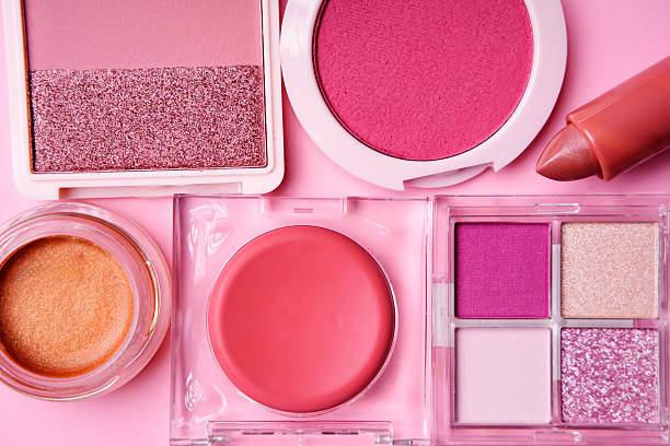 istock Decorative cosmetics forming a frame on a pink background 2217154779
