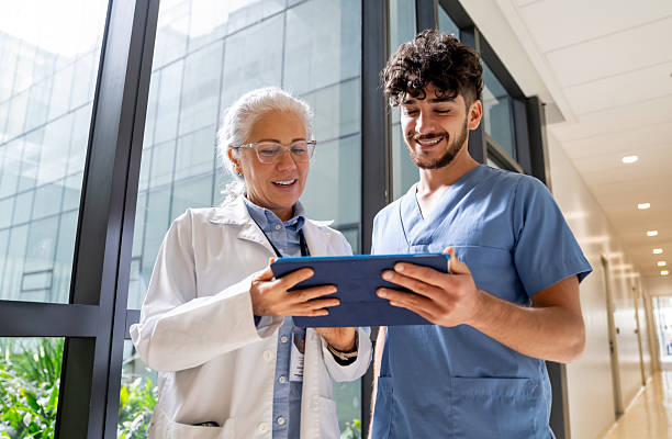 istock Doctor discussing test results with nurse using a digital tablet 2217159655