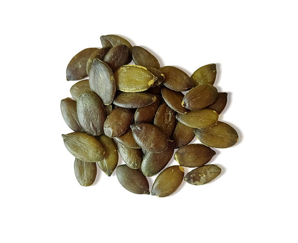 istock Pumpkin seeds isolated on white background 2217164940