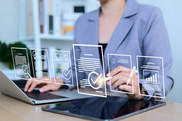 istock Document review and quality control process concept. Businesswoman using laptop with document and checkmark icons represents review, validation, auditing, verification, approval, compliance, workflow, 2217168512