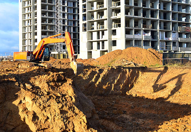 istock Excavator on earthworks on Construction site. Building under construction, building renovation. 2217170807