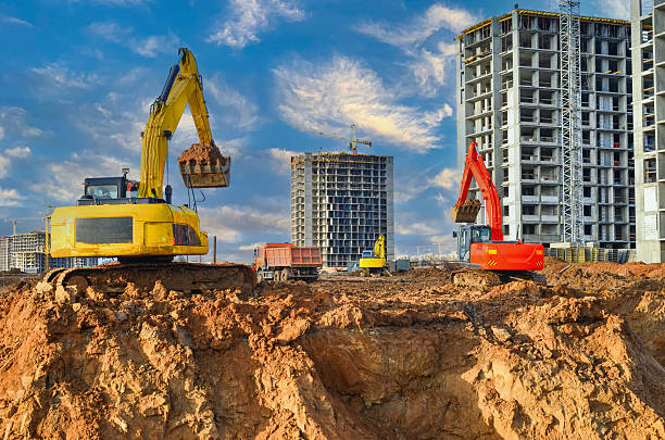 istock Excavator on earthworks on Construction site. Building under construction, building renovation. 2217170906