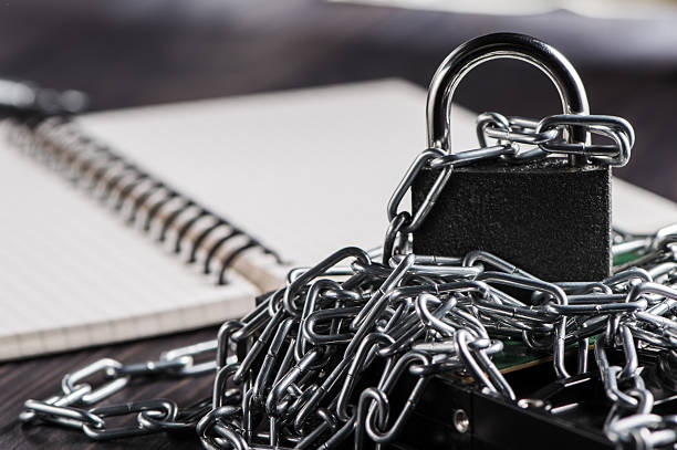 The metal pad connects the chains into a single security system. The lock looks unshakable, emphasizing reliability and stability. The symbolic padlock creates a sense of security.