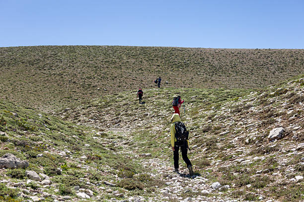 istock a group of people hiking in the mountains 2217172992