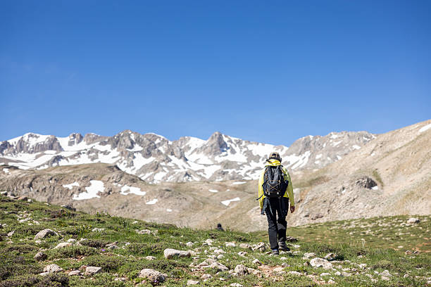 istock woman hiking in the mountains 2217173050