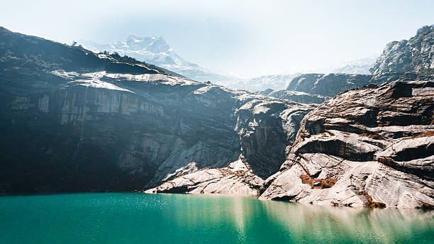 Glacial lagoon on edge of glaciated mountain