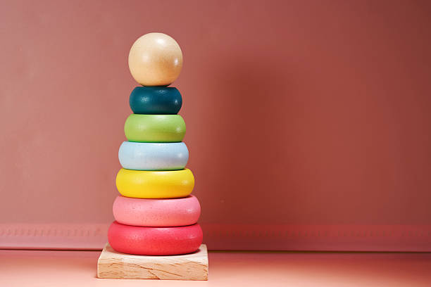 Close-Up Of Multi Colored Toy Blocks Against White Background