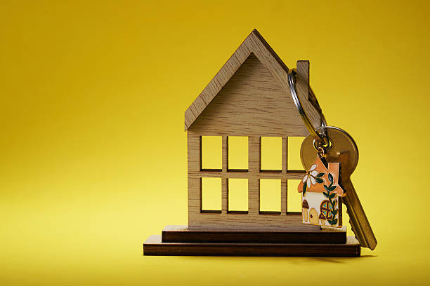 istock house shape keyring hanging on model  house. 2217177179