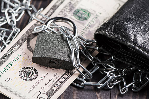 istock The chains and lock enclose five dollars 2217177527