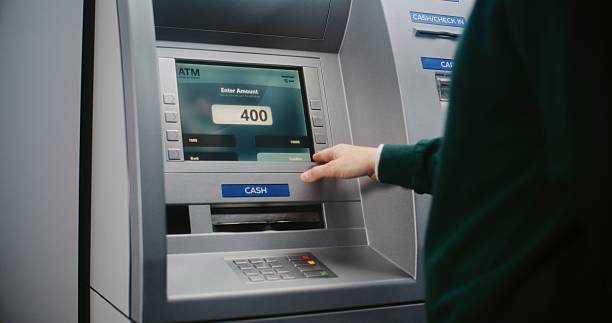 istock Unrecognizable Person Entering PIN Code. Error Message on Cash Machine Display Due to Lost Connection 2217180065