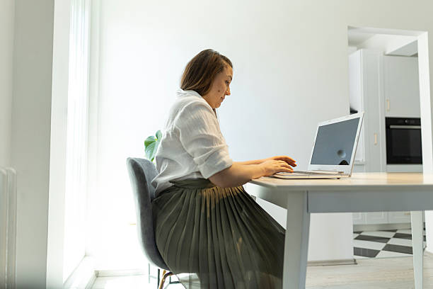istock Pregnant woman working at home 2217180599