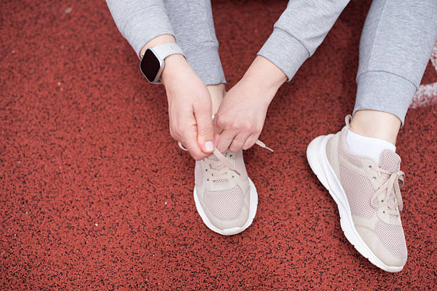 istock Woman Tying Shoelaces 2217183245