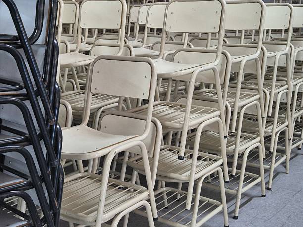 istock school desks stacked in a shed 2217185207