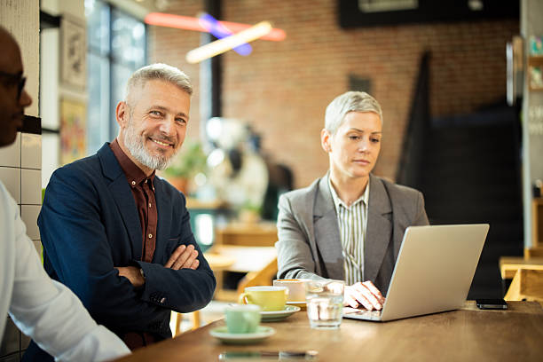 istock Business people having informal meeting in cafe 2217186561