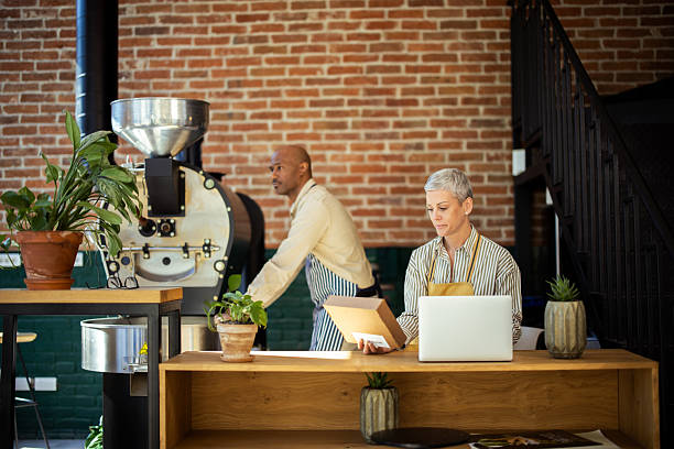 istock Coffee roasters preparing orders and managing inventory in their coffee shop 2217186714