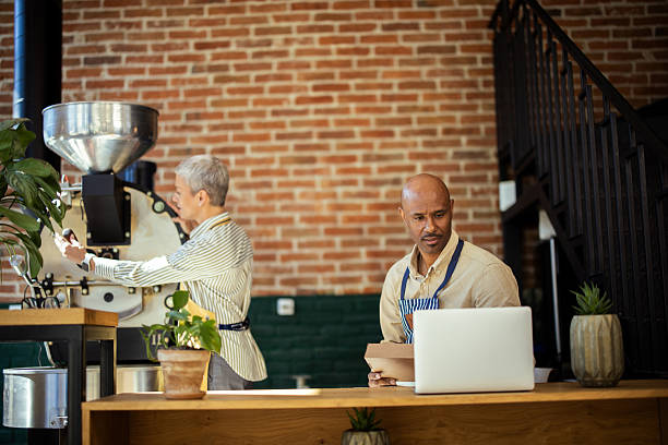 istock Coffee roasters working in their coffee shop 2217186723