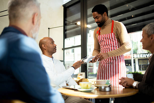 istock Customer paying with contactless payment in cafe 2217187508