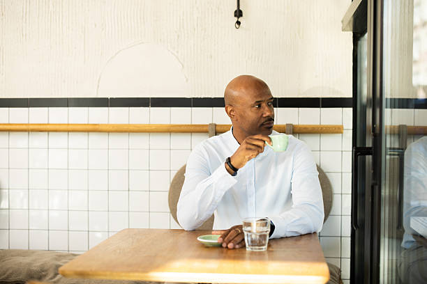istock Thoughtful entrepreneur enjoying a coffee break in a modern cafe 2217187545