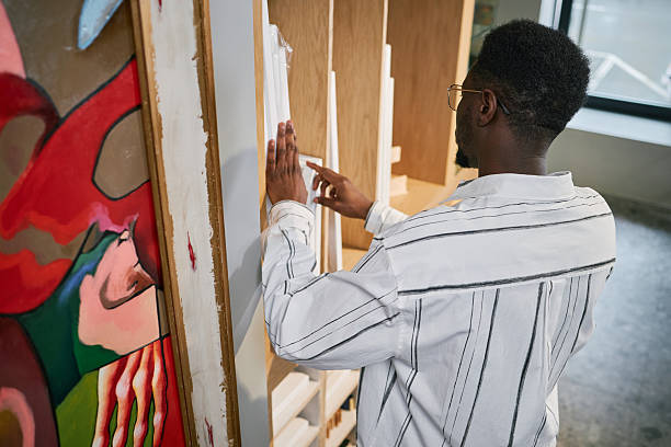 istock Examining Large Canvas Painting in Art Studio Space 2217187723