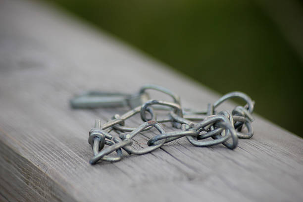 A forgotten chain on a wooden bridge