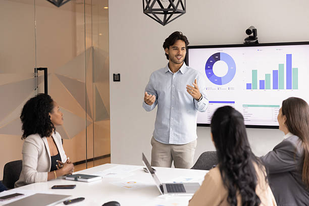 istock Young male professional presenting data to teammates 2217189833