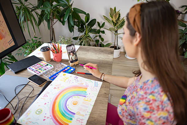 istock Woman Draws for Pride Event 2217190081
