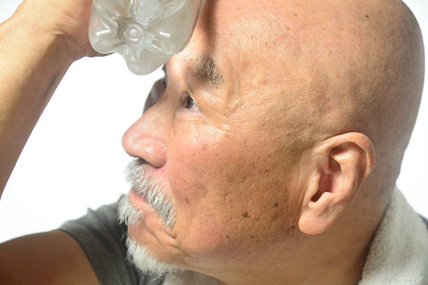 istock Elderly people take measures against heat stroke by staying hydrated 2217190710