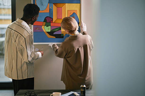 istock Examining Modern Art Piece in Gallery Setting Together 2217190718
